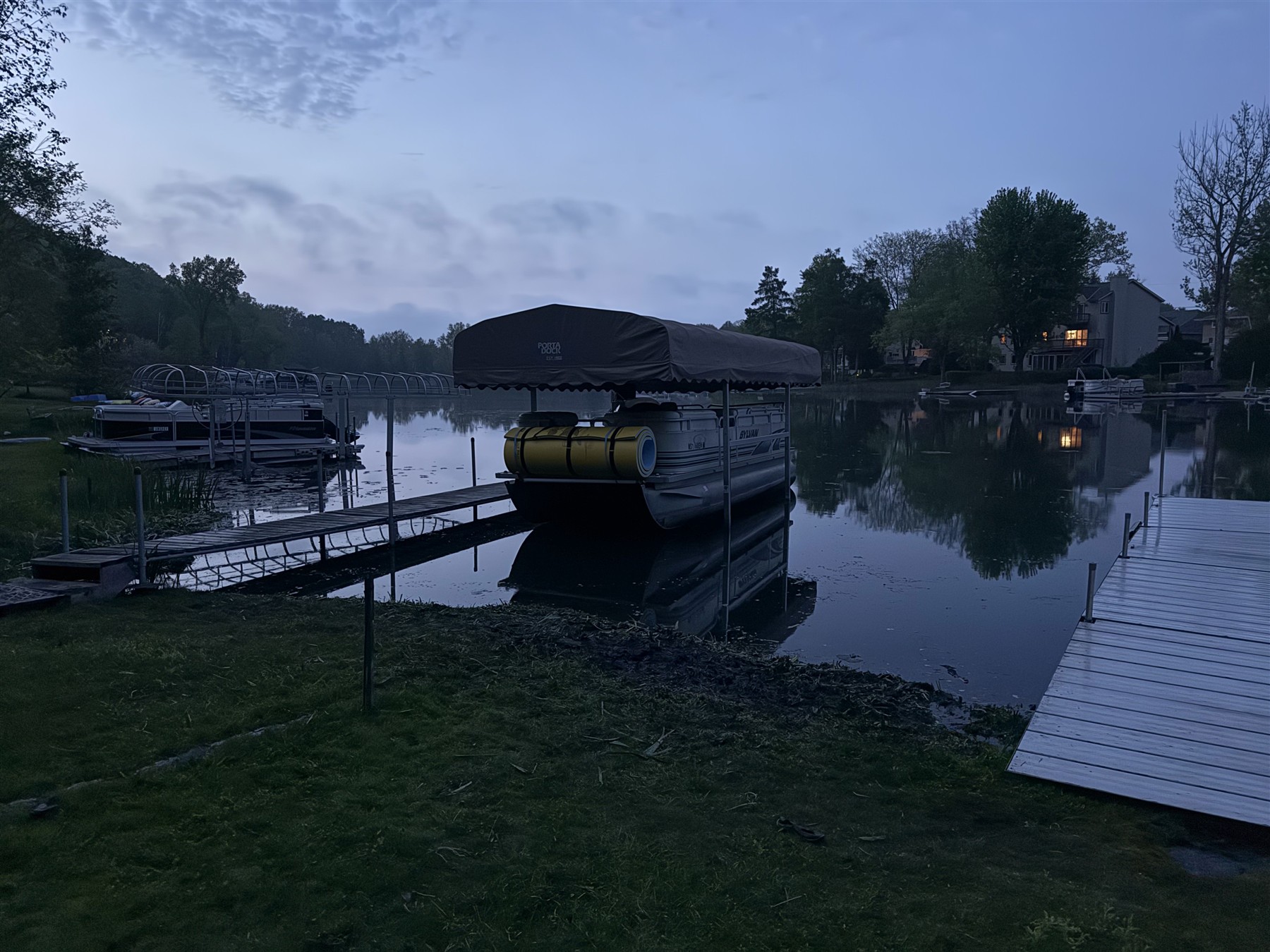 Lakefront dock and boat area in the evening